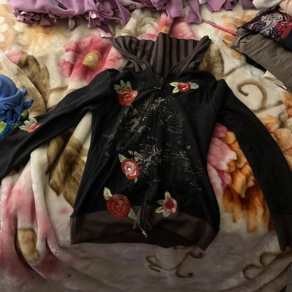 brown zip up is a bit worn down and has two zippers